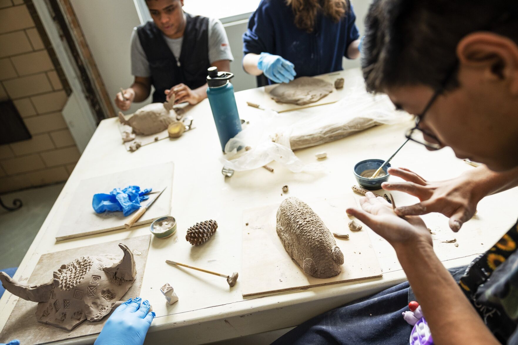 Neurodivergent students learn ceramics in art workshop